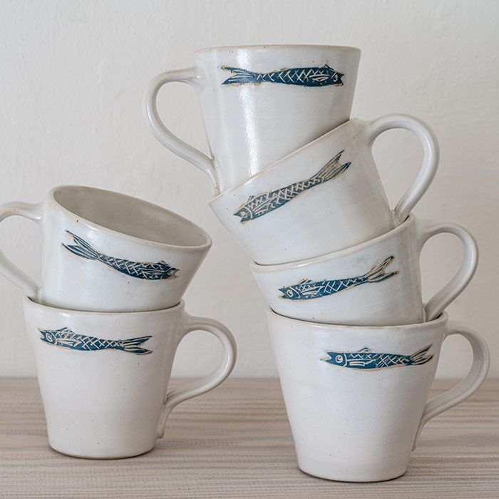 small pastel coffee cups with fish motif