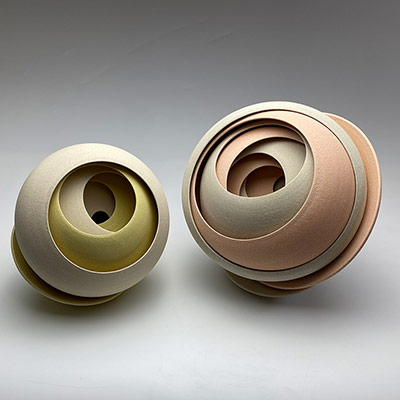 Two Interlocking ceramic sculptures by Matthew Chambers